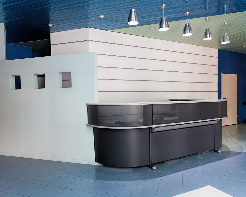 contemporary-reception-counter-in-a-hallway-of-com-2025-10-09-17-55-59-utc